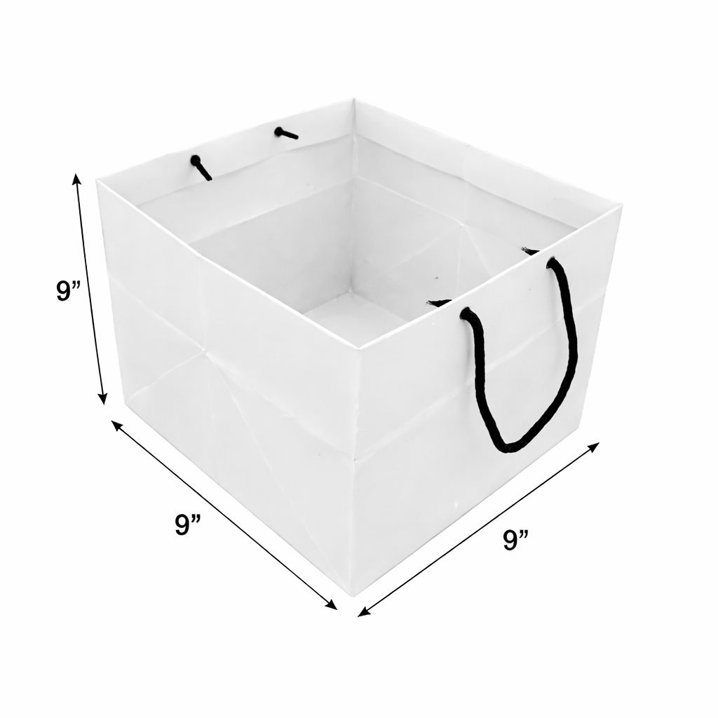 9 x 9 x 9 inch white paper gift bag with black handles for bakery and gift packaging.