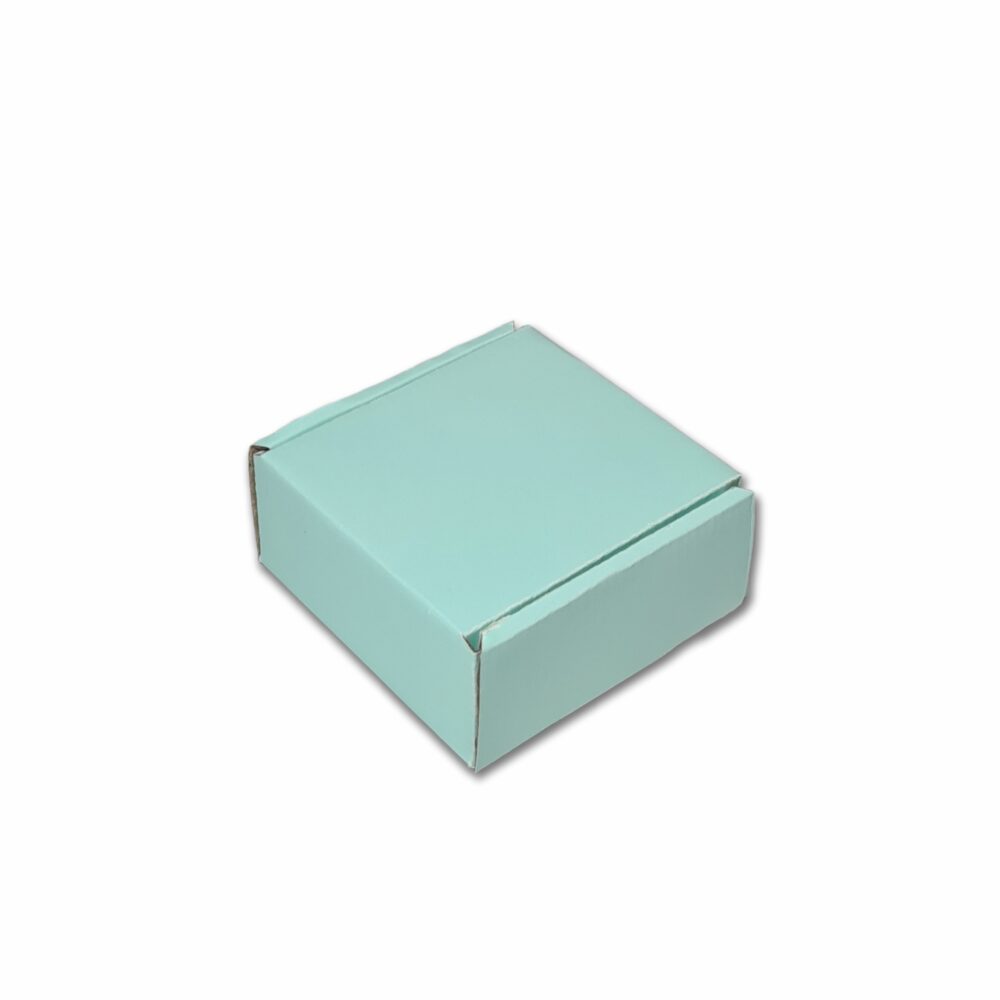 A pastel green corrugated cardboard hamper box with a closed lid, designed for packaging and storage.